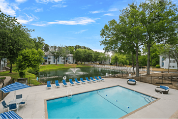 Refreshed swimming pool with poolside furniture